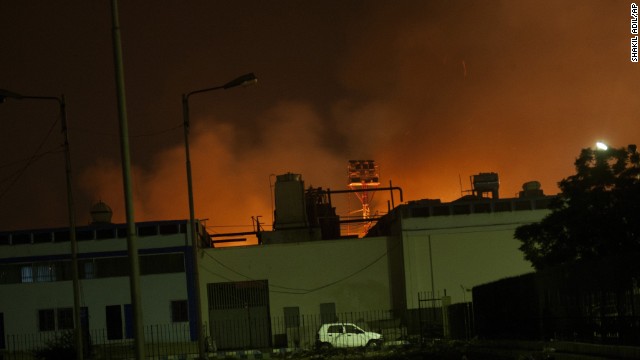 Fire illuminates the sky above a terminal at the Karachi airport, Pakistan's largest and busiest. 