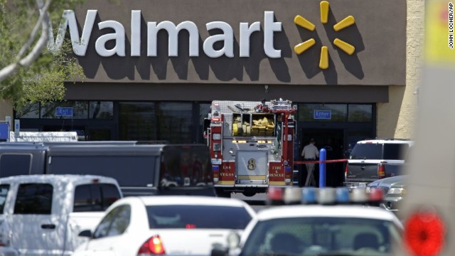 Police and firefighters on the scene of the shooting at a Las Vegas Walmart, on Sunday, June 8. Two gunmen shot and killed two police officers eating lunch and then killed a third person at the Walmart. The gunmen then killed themselves. 