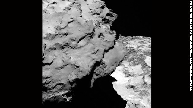 In a second image taken 120 km away from comet 67P/Churyumov-Gerasimenko, the comet's "head" can be seen in the left of the frame as it casts a shadow over the "body." The two images released August 6 were taken by Rosetta's OSIRIS narrow-angle camera.