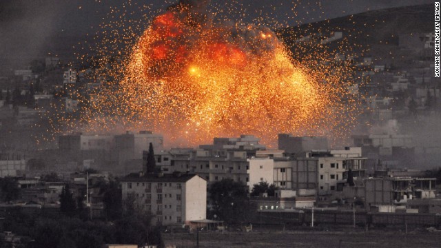 An explosion rocks Kobani, Syria, during a reported car-bomb attack by ISIS militants on Monday, October 20. Civil war has destabilized Syria and created an opening for the militant group, which is also advancing in Iraq as it seeks to create an Islamic caliphate in the region.