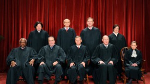 The justices of the U.S. Supreme Court sit for their official photograph on October 8, 2010, at the Supreme Court. Front row, from left: Clarence Thomas,  Antonin Scalia, Chief Justice John G. Roberts, Anthony M. Kennedy and Ruth Bader Ginsburg. Back row, from left: Sonia Sotomayor, Stephen Breyer, Samuel Alito Jr. and Elena Kagan. Scalia was found dead on February 13 at a Texas ranch he was visiting.