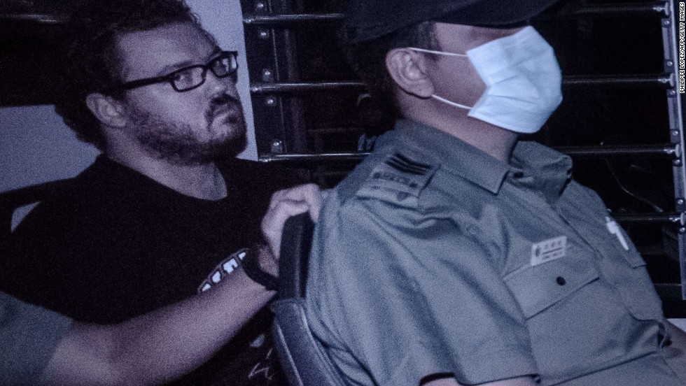 British banker Rurik Jutting seen in a police van November 10, 2014. 