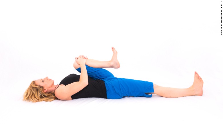 Supine bent-knee twist: Stretches hip, groin and low-back muscles. 