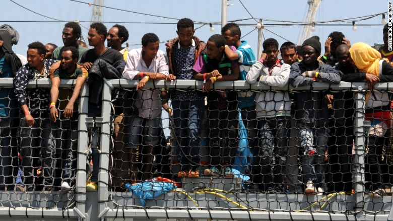Migrants wait to disembark from the German navy ship Hessen in Palermo, Italy, on Sunday, June 7. European rescue boats are bringing &lt;a href=&quot;http://www.cnn.com/2015/06/07/europe/mediterranean-migrants-rescue/index.html&quot;&gt;thousands of migrants&lt;/a&gt; to safety as they try to cross the Mediterranean Sea. There has been &lt;a href=&quot;http://www.cnn.com/2015/04/21/europe/mediterranean-boat-migrants-lister/index.html&quot;&gt;a surge&lt;/a&gt; in the number of migrants making the dangerous journey toward Europe&#39;s shores.