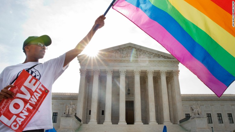 Carlos McKnight of Washington waves a flag in support of same-sex marriage outside the U.S. Supreme Court on Friday, June 26. &lt;a href=&quot;http://www.cnn.com/2015/06/26/politics/supreme-court-same-sex-marriage-ruling/index.html&quot;&gt;The Supreme Court ruled 5-4&lt;/a&gt; Friday that states cannot ban same-sex marriage, handing gay rights advocates their biggest victory yet. See photos from states that approved same-sex marriage before the nationwide ruling:
