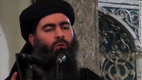 An image grab taken from a propaganda video released on July 5, 2014 by Al-Furqan Media allegedly shows the leader of the Islamic State (IS) jihadist group Abu Bakr al-Baghdadi, aka Caliph Ibrahim, adressing Muslim worshippers at a mosque in the militant-held northern Iraqi city of Mosul. Baghdadi, the self-proclaimed caliph of the brutal jihadist Islamic State (IS) group that has seized large chunks of Iraq and Syria, made the AFP shortlist of most influential people of 2014. AFP PHOTO / HO / AL-FURQAN MEDIA 