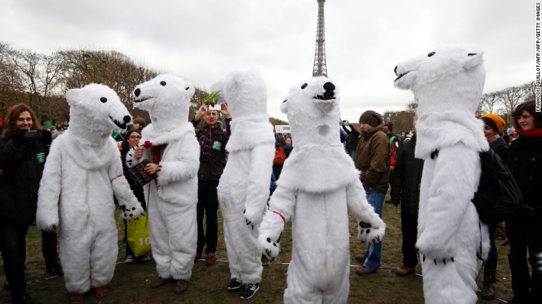 Demonstrators dress up as polar bears to take part in a climate rally Saturday in Paris.