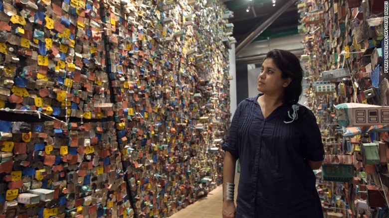 Indian artist Hema Upadhyay poses in front of her &quot;Think Left, Think Right, Think Low, Think Tight&quot; installation at the Paris's Pompidou Centre on May 23, 2011.