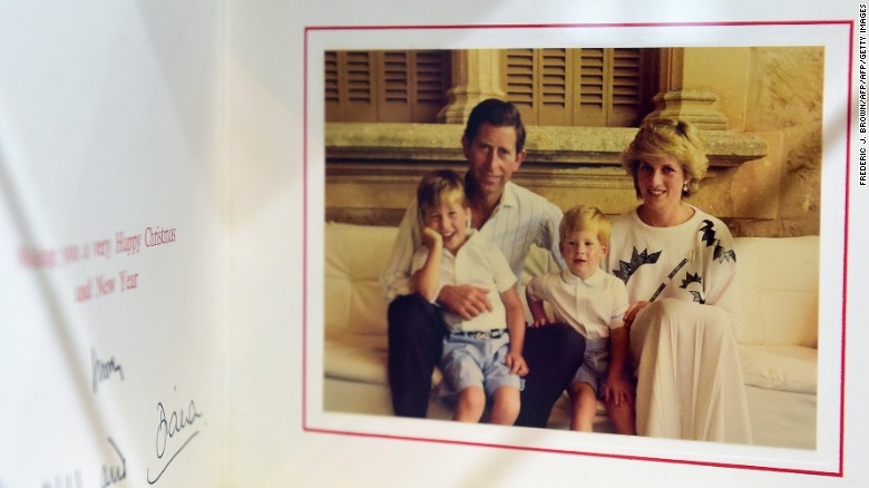 A 1987 Christmas card signed by Prince Charles and Princess Diana with their children, Prince William and Prince Harry. 