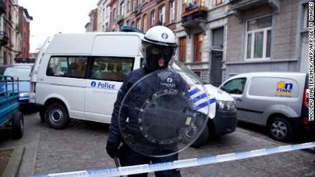 A policeman stands guard in Molenbeek, Brussels, on March 19, 2016, after Paris attacks suspect Salah Abdeslam was arrested.