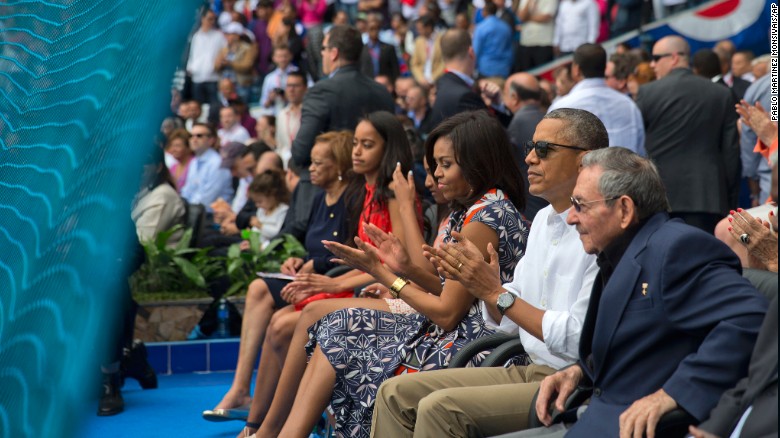 U.S. President Barack Obama attends a baseball game in Havana, Cuba, with his family and Cuban President Raul Castro, right, on Tuesday, March 22. The Cuban national team was playing an exhibition against Major League Baseball's Tampa Bay Rays. Obama is the first U.S. President to visit Cuba since Calvin Coolidge in 1928.