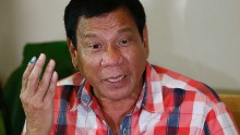 Front-running presidential candidate Mayor Rodrigo Duterte gestures during his second news conference after voting in a polling precinct at Daniel R. Aguinaldo National High School, Matina district, his hometown in Davao city in southern Philippines Monday, May 9, 2016. Duterte was leading by a wide margin in unofficial tallies but still refuses to claim victory. (AP Photo/Bullit Marquez)