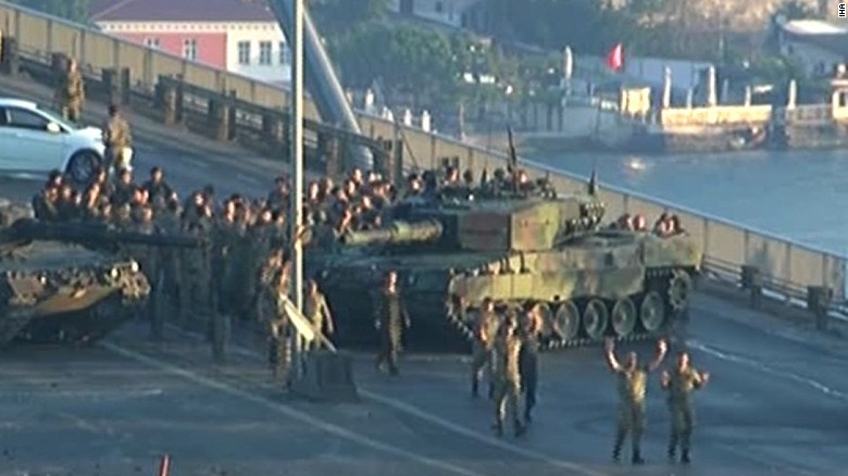Turkish soldiers walk with hands up