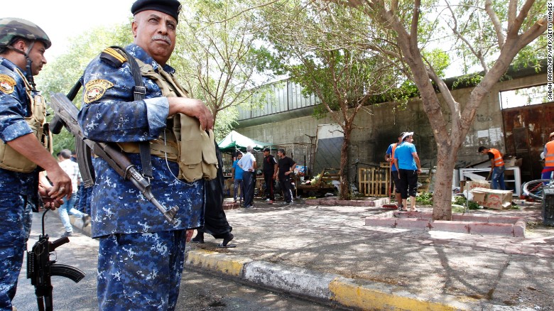 Iraqi security forces stand guard at the site of Sunday&#39;s blast.