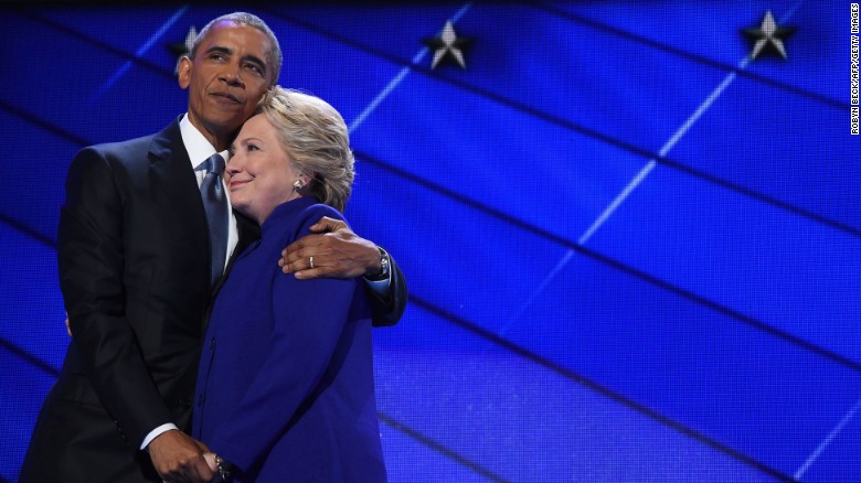 Obama hugs Clinton during the third night of the Democratic National Convention in Philadelphia, Pennsylvania.