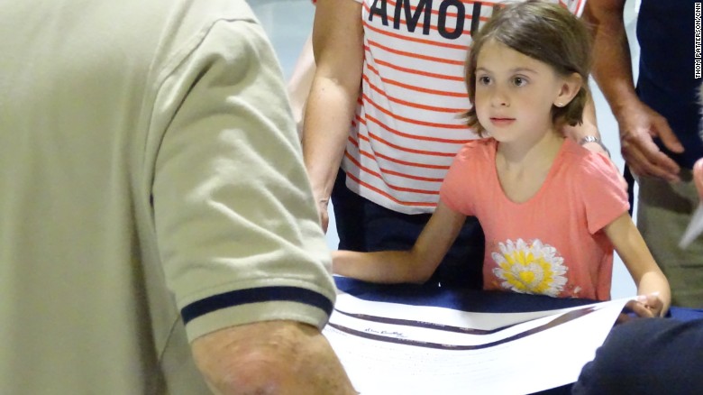A young visitor at Saturday&#39;s event asks an ex-crew member to sign her Blackbird poster. 