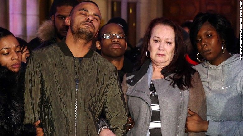 Mark Duggan&#39;s brother Marlon and mother Pam leave the Royal Courts of Justice in London after an inquest found Mark&#39;s death was lawful.
