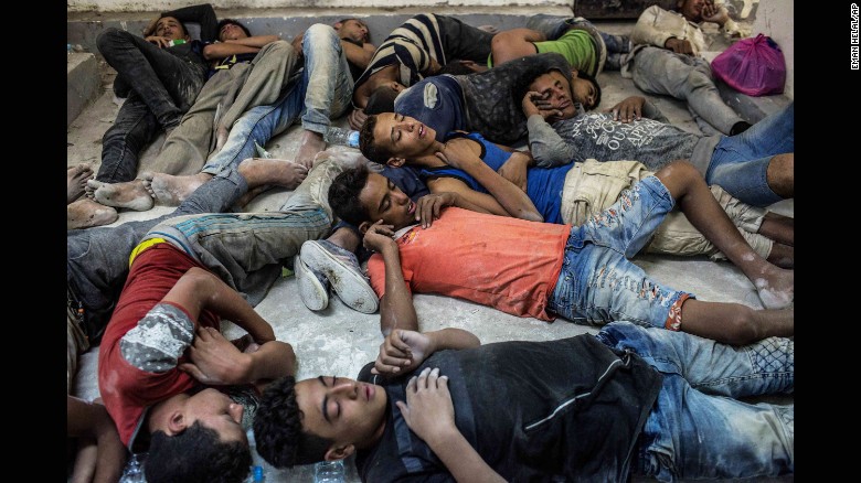 Survivors of a boat that capsized in the Mediterranean on Wednesday sleep in an Egyptian police station.