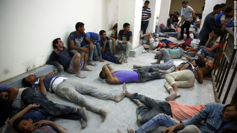 Survivors, rescued by Egyptian Coast Guard members from a boat submerged on its way to Europe at the Mediterranean Sea.