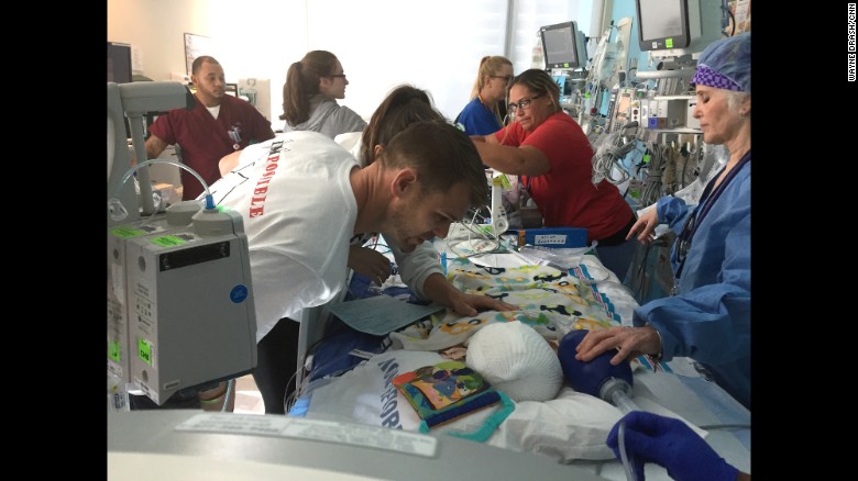 Christian McDonald gets a closer look at Anias as medical staff continue to monitor the twins' conditions.