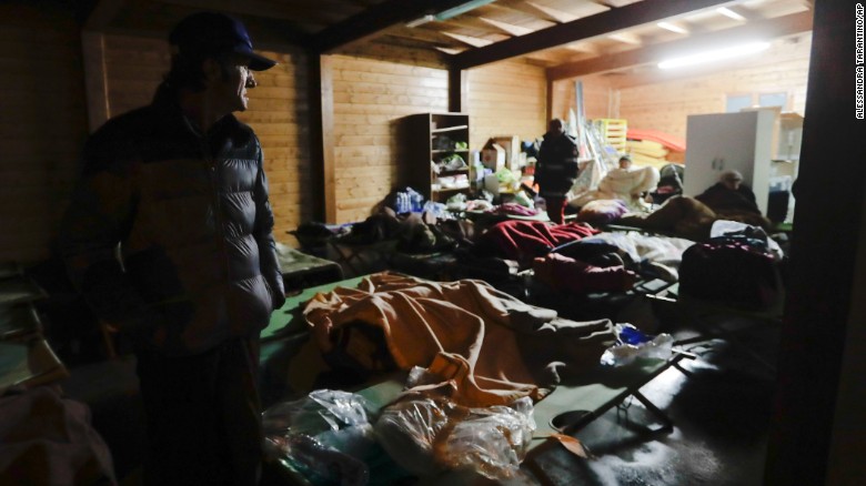 Residents prepare to spend the night in makeshift shelters in Visso.