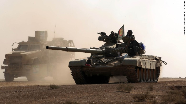 An Iraqi forces tank advances towards the village of Salmani, south of Mosul, on Sunday.