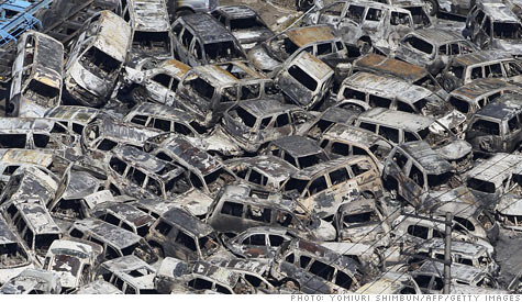 Expect car prices to rise as the effects of Japan's earthquake and violence in Libya begin to be felt. In this image, cars that had been ready for export are piled up in a Japanese port.