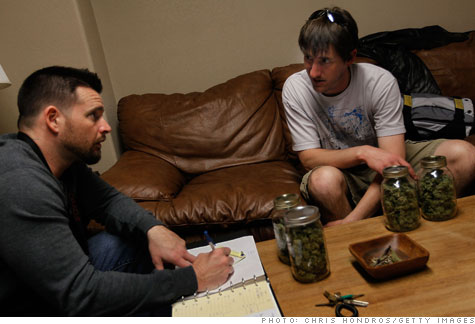 Abundant Healing co-owner Drew Brown meets with one of his store's marijuana suppliers.