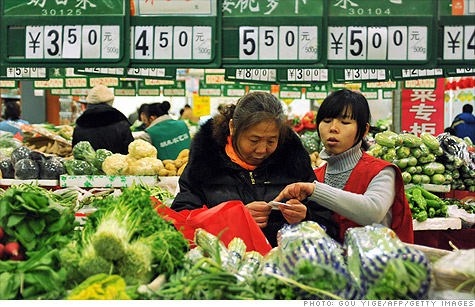 China's economy grew at a slightly slower rate in the first quarter, as food prices continued to surge and limit the purchasing power of consumers.