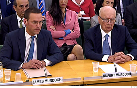 Rupert Murdoch, right, his wife Wendi, center, and son James, left, and other Murdoch family members have lost $750 million from the News Corp. stock plunge.