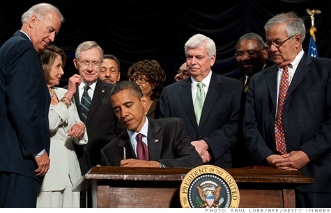 President Obama signs the Dodd-Frank law on July 21, 2010. Law namesakes Christopher Dodd and Barney Frank are standing on the right.