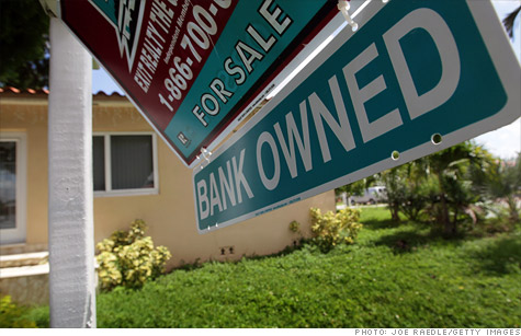 A Bank Owned sign is seen in front of a foreclosed home on September 16, 2010 in Miami, Florida.