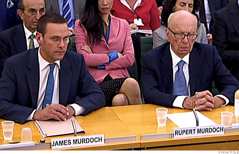 Rupert Murdoch and his son James Murdoch of News Corp. testify before the British Parliment in July. Both got big pay raises from the company, although James Murdoch returned his $6 million bonus.