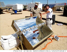 A Hoplite inventor shows a Marine what the combination solar power producer/hot water heater can do.