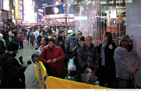 Macy's will join other retailers like Toys 'R' Us, pictured here on Black Friday 2009, with thousands of shoppers lining up in Times Square just before midnight.