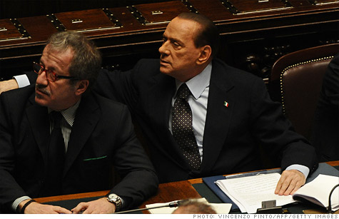 Italian Prime Minister Silvio Berlusconi (right) has vowed to step down, but that didn't keep 10-year bond yields from hitting record highs.