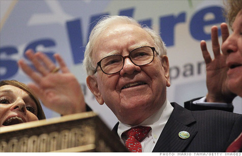 Berkshire Hathaway Chief Executive Warren Buffett, shown here ringing the bell at the New York Stock Exchange on Sept. 30, has reportedly bought $10.7 billion worth of IBM shares.