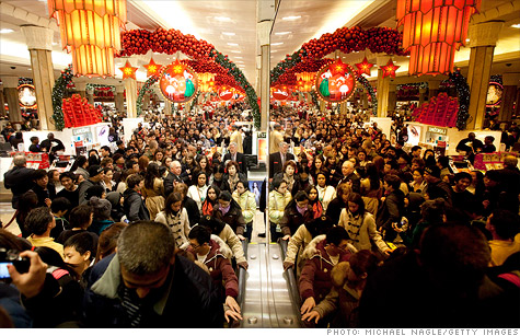 Shoppers jam Macy's flagship store in New York's Herald Square in the first minutes of Black Friday.