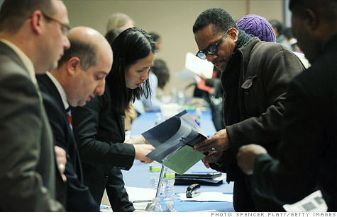 Job seekers speak with perspective employers at the New York Career Fair.