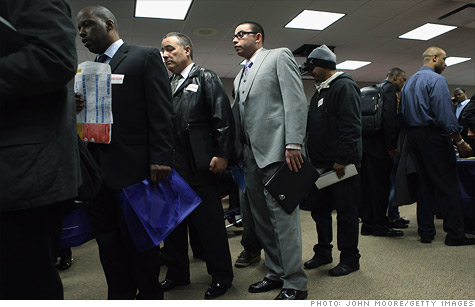 U.S. military veterans line up to meet potential employers during a veterans job fair in New York.
