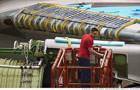 A Boeing employee works on an assembly line at the company's factory in Everett, Wash. New orders for nondefense aircraft and parts plummeted 19% in January.
