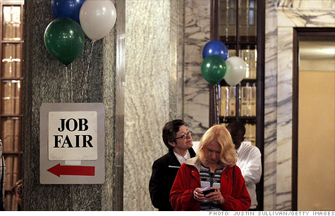 Job seekers wait in line to enter the San Francisco Hirevent job fair at the Hotel Whitcomb on March 27, 2012.