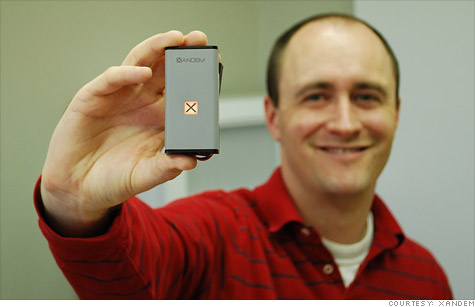 Xandem founder Joey Wilson shows off the company's motion-detecting sensor nodes.