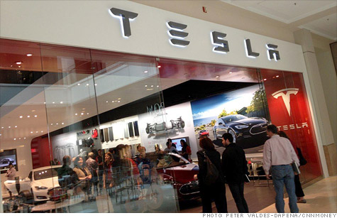 Tesla's shopping mall stores are expected to get more traffic than traditional dealerships but could face legal challenges.