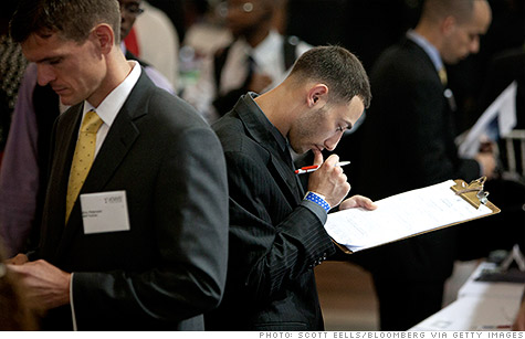 A job seeker fills out an application at the Veterans On Wall Street job fair in New York.