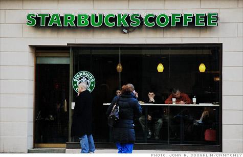 Starbucks shares were trading lower after the coffee giant lowered its outlook.