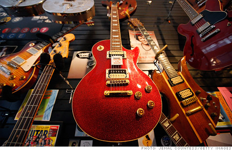 Gibson Guitar has settled with federal authorities for illegally importing ebony and rosewood from India and Madagascar.