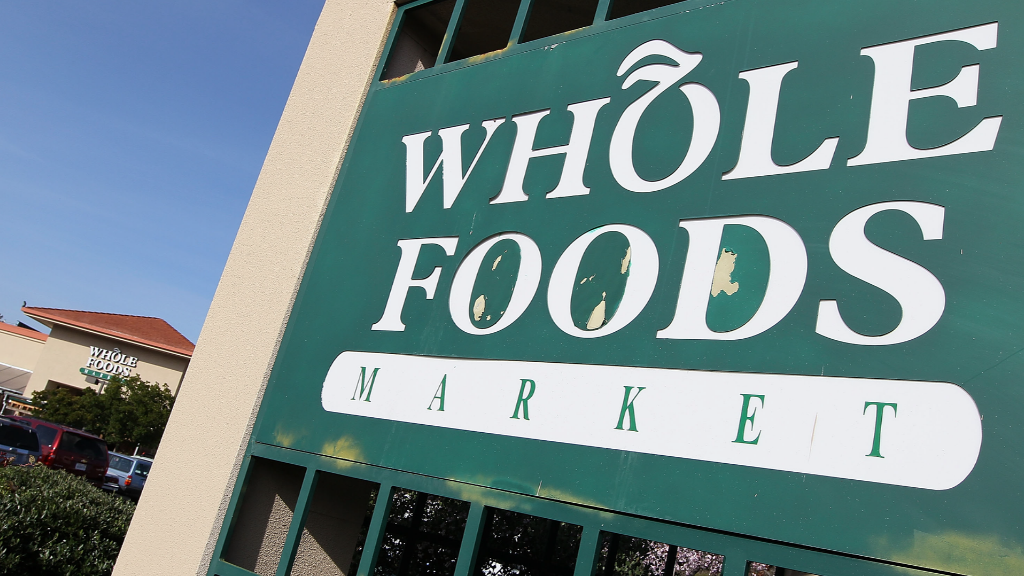 Why Whole Foods restricts executive pay