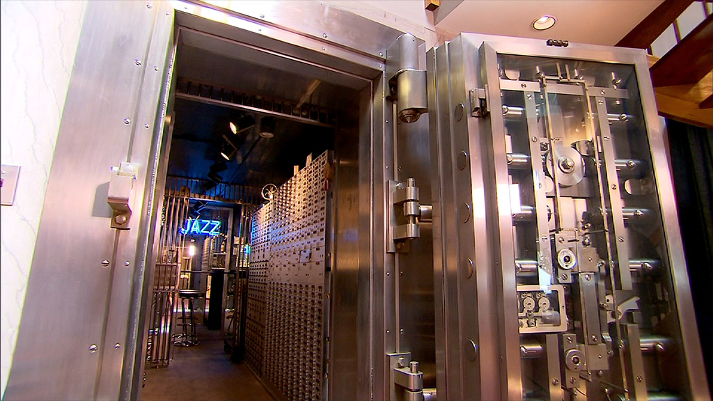 A fully-stocked bar in a vault - Inside a bank turned luxury home ...