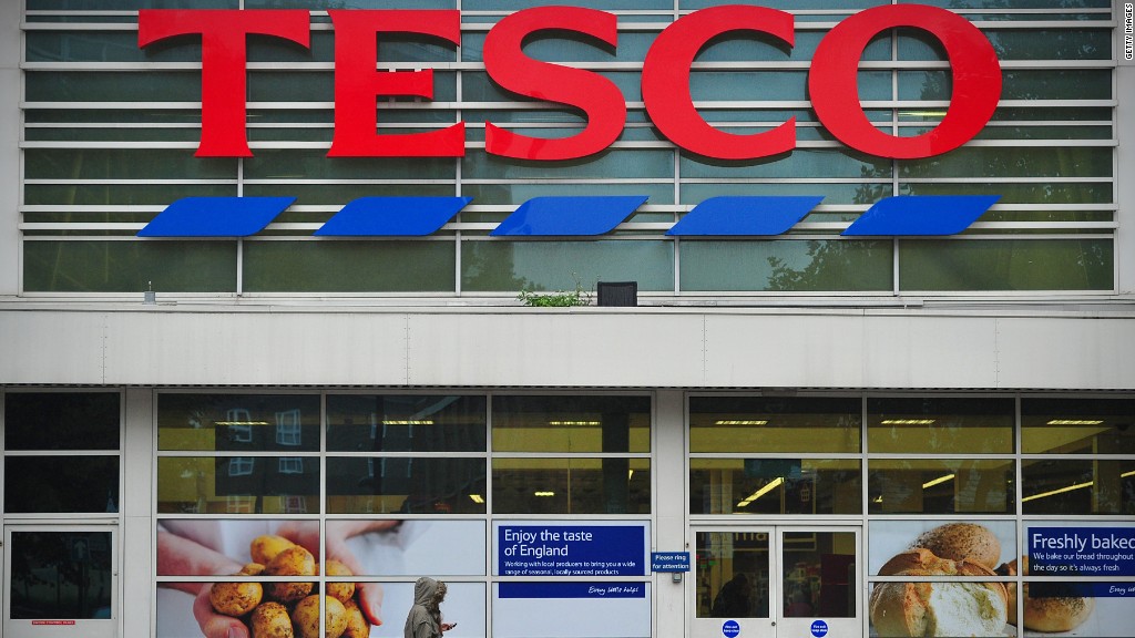 Tesco reports $408 million profit error